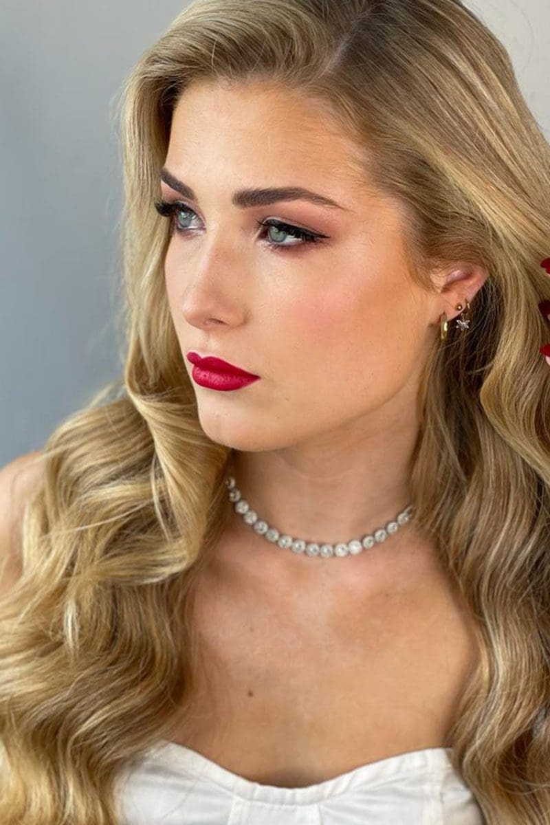 A bride having makeup applied