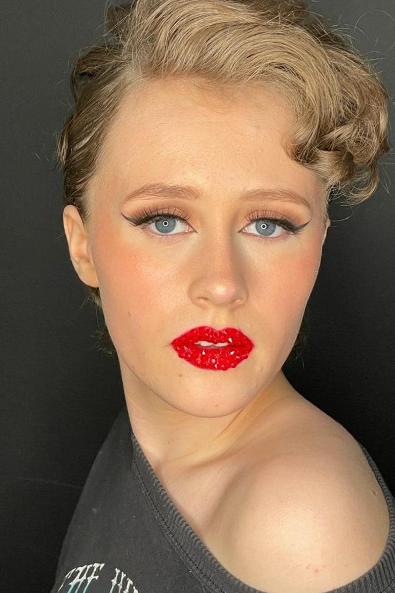 A makeup artist between takes
