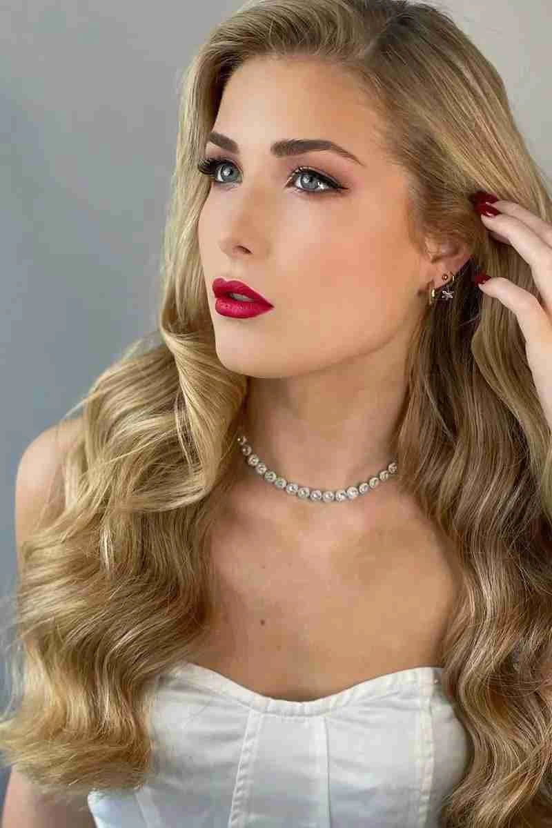 A freelance makeup artist working with a client