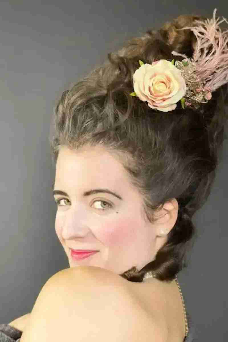 Girl with flowers in hair striking a pose
