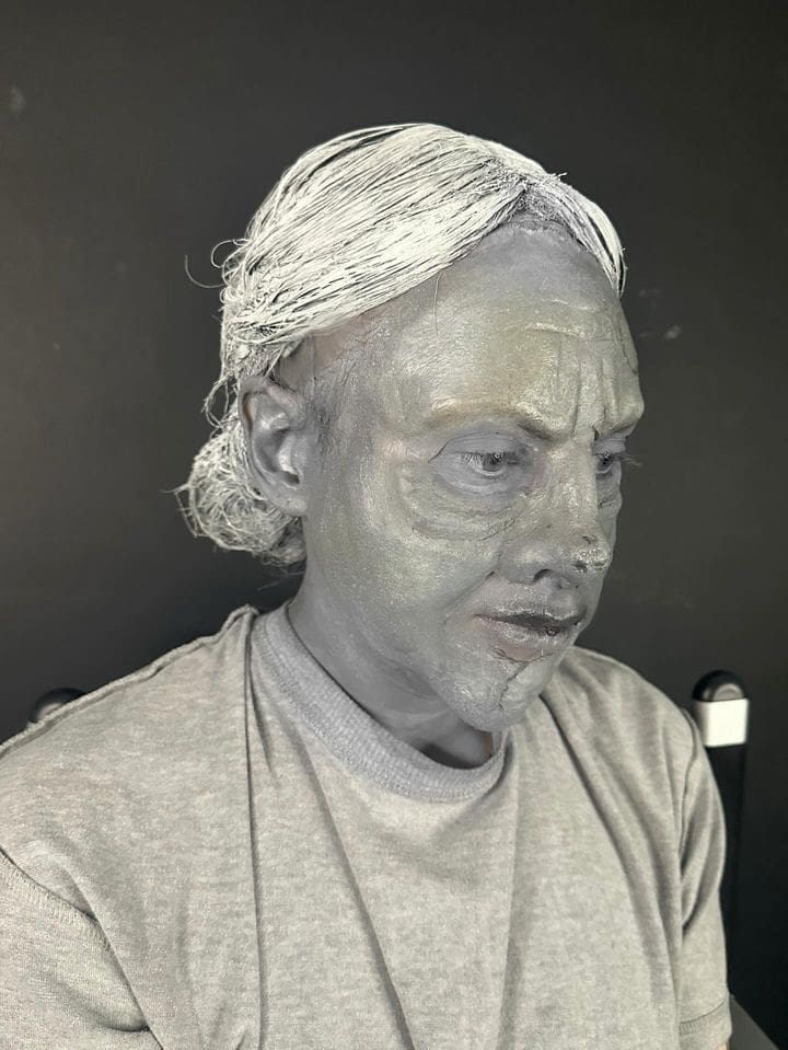 A makeup artist at work in a professional studio